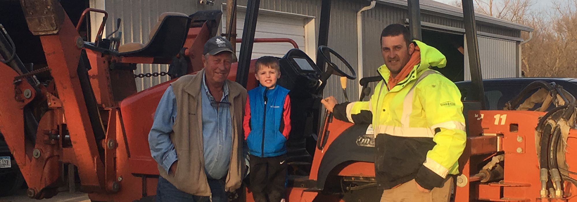 Nate Brockhouse standing in front of a well driller on a Brockhouse Well & Pump job site